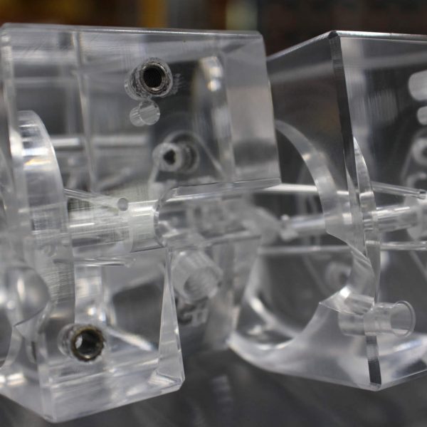 CNC Milled Plastic Manifolds with Steel Fittings Ultrasonically Inserted