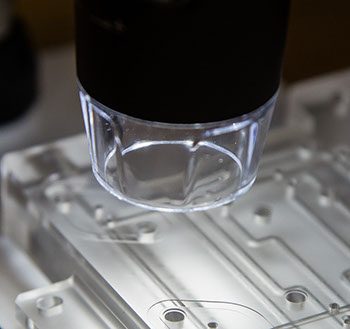Light Used to Inspect the Microfluidic Channels in a Diffusion Bonded Plastic Manifold