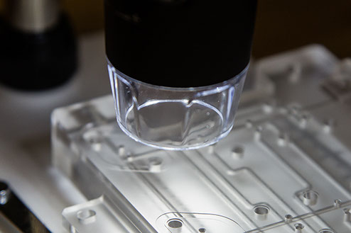 Light Used to Inspect the Microfluidic Channels in a Diffusion Bonded Plastic Manifold