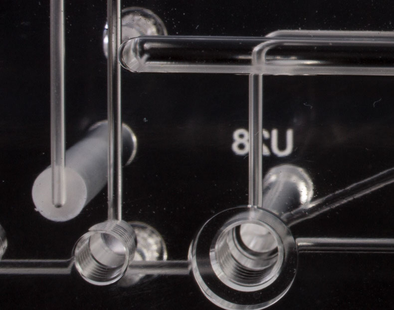 Close Up of Microfluidic Burr Free Pathways in a Diffusion Bonded Plastic Microfluidic Manifold