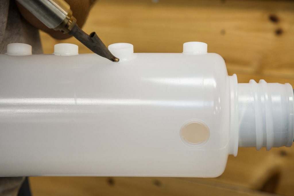 Plastic Welding a Level-Sensing Container Carboy & Bottle Assembly